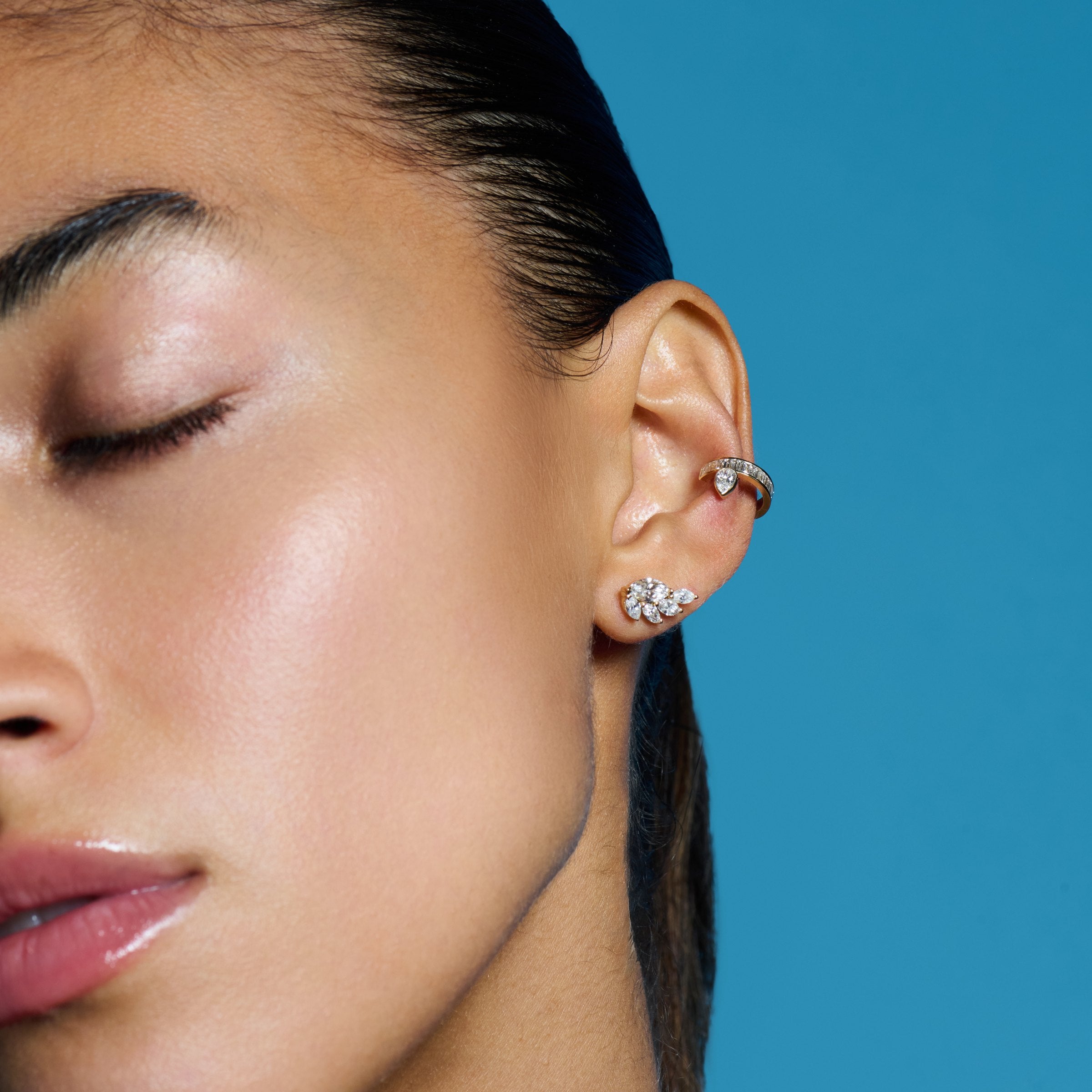 E’LHAA Modernist pear and baguette ear cuff in yellow gold, worn
