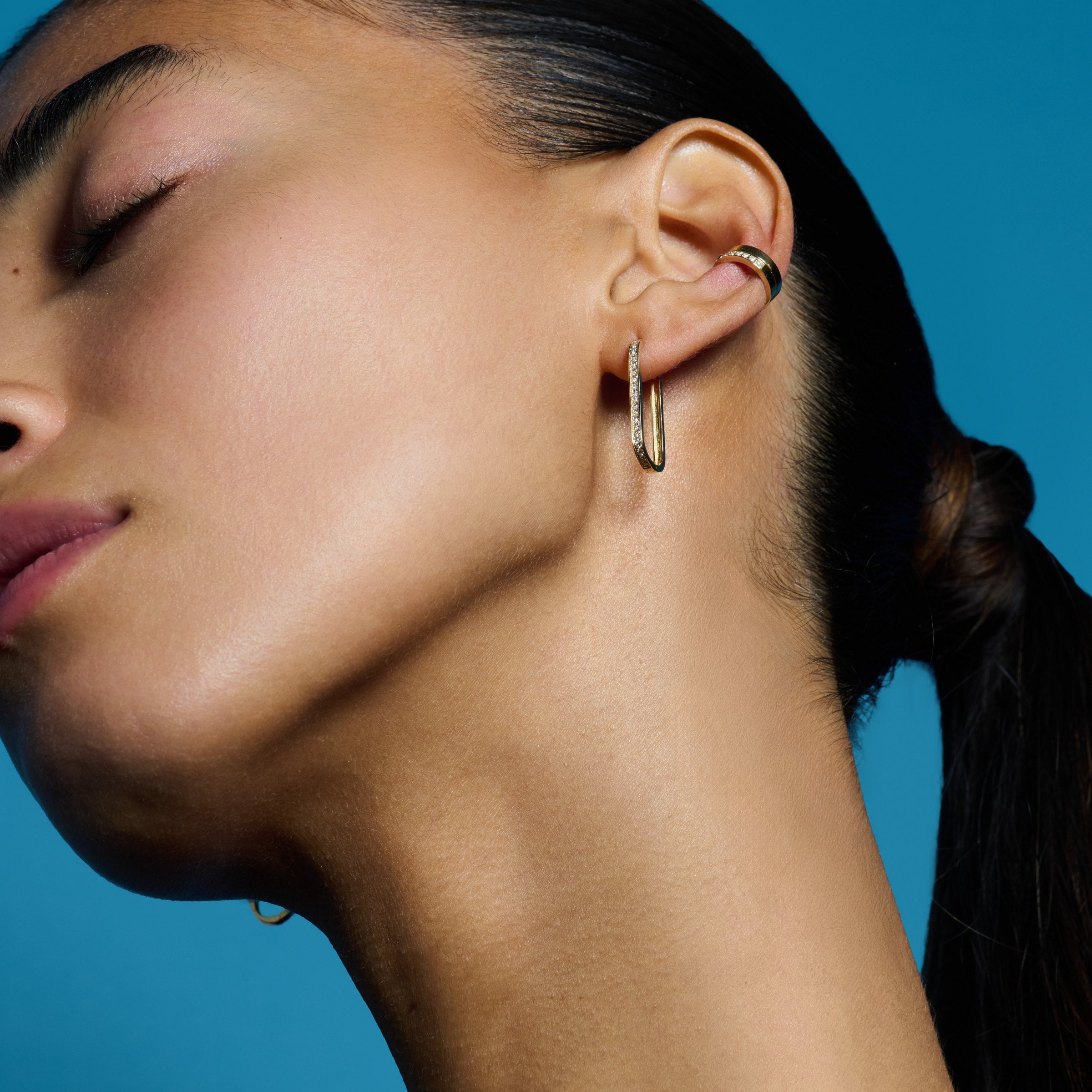 E’LHAA Luxe oval huggie earrings in yellow gold, worn