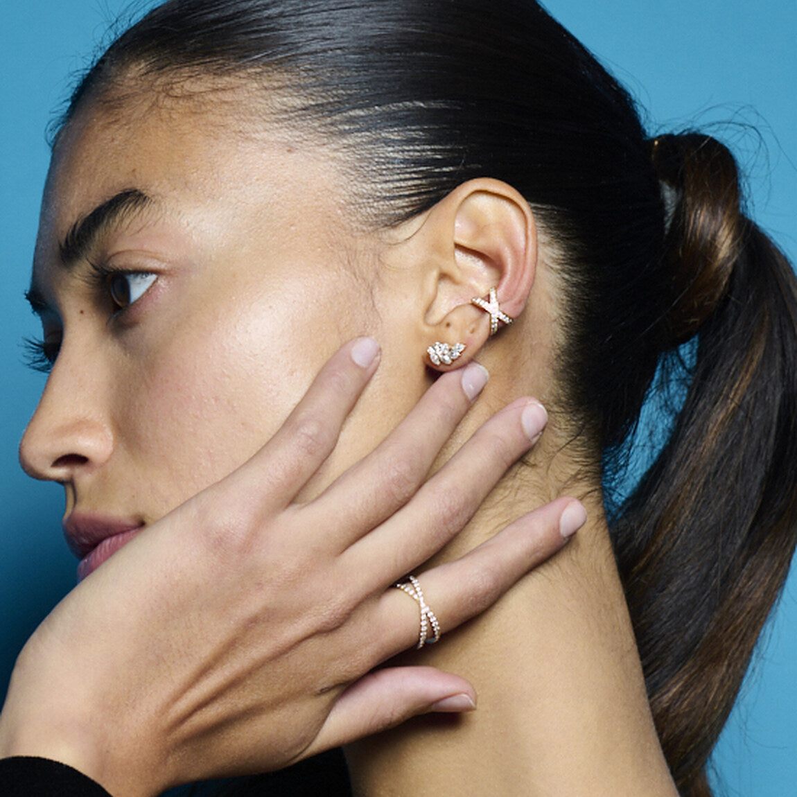 Model wearing E’LHAA jewellery on blue